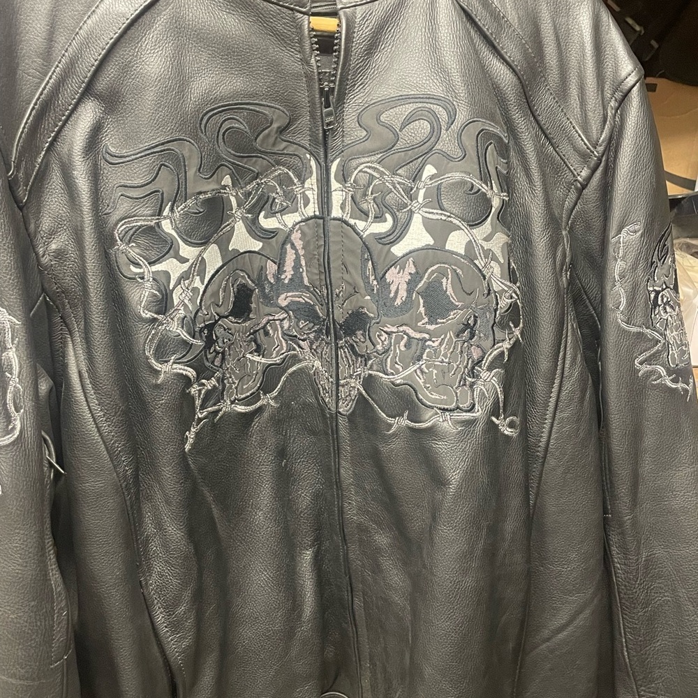 Xelement Black Leather Jacket with Skull Design, this design is highly visible